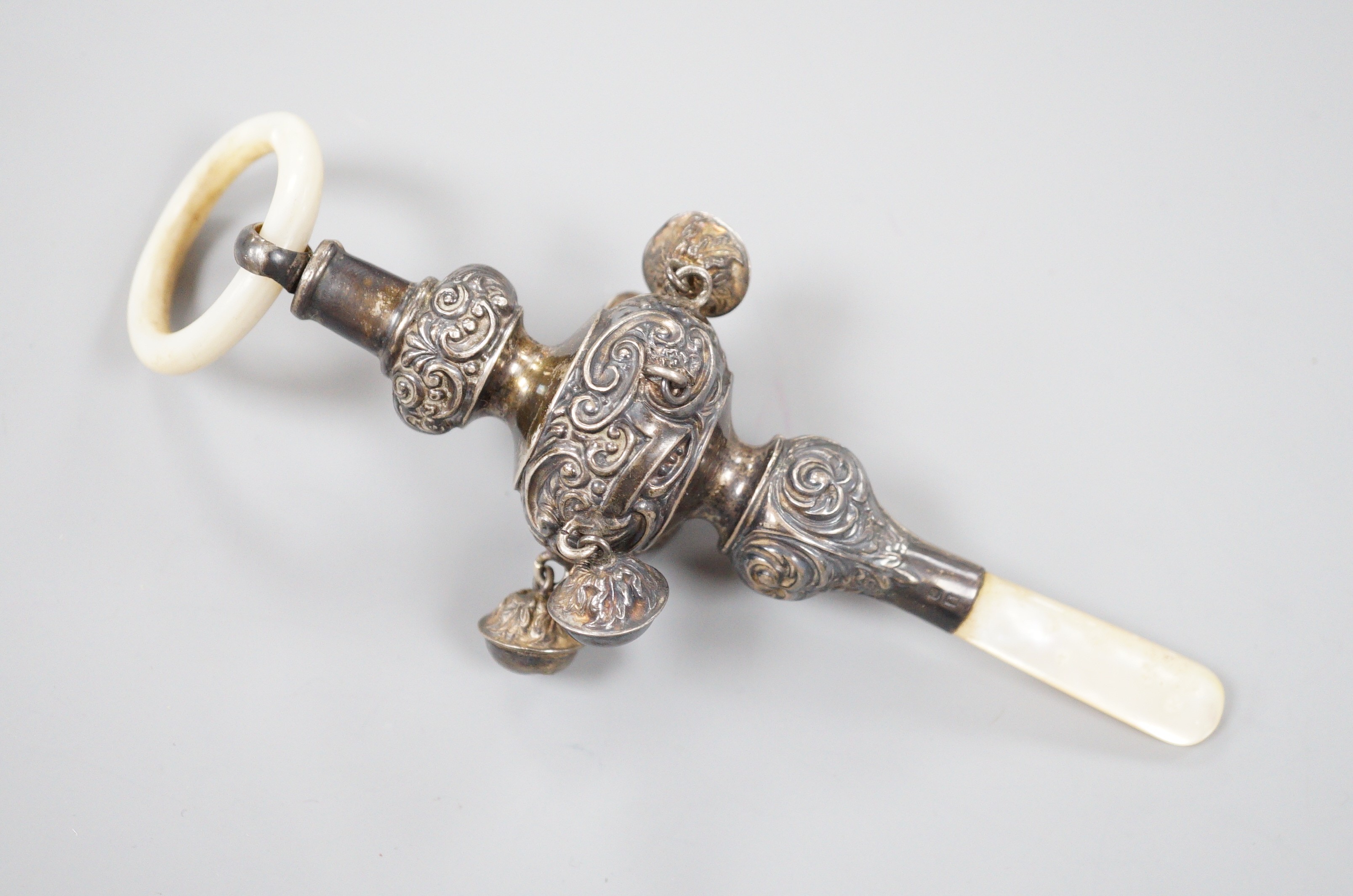 An Edwardian silver and mother of pearl mounted child's rattle, Birmingham, 1904, 16.2cm.